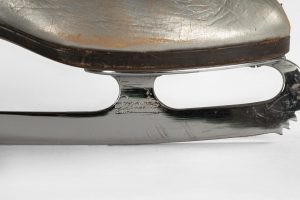 Detail shot of the front portion of Sonja Henie’s skate blade, chrome plated steel.