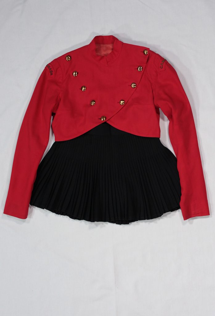 A photo of red and black skating dress. The costume has a red bodice with long red sleeves and a short black skirt.
